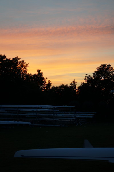 The sun setting over the boat trailer park. 